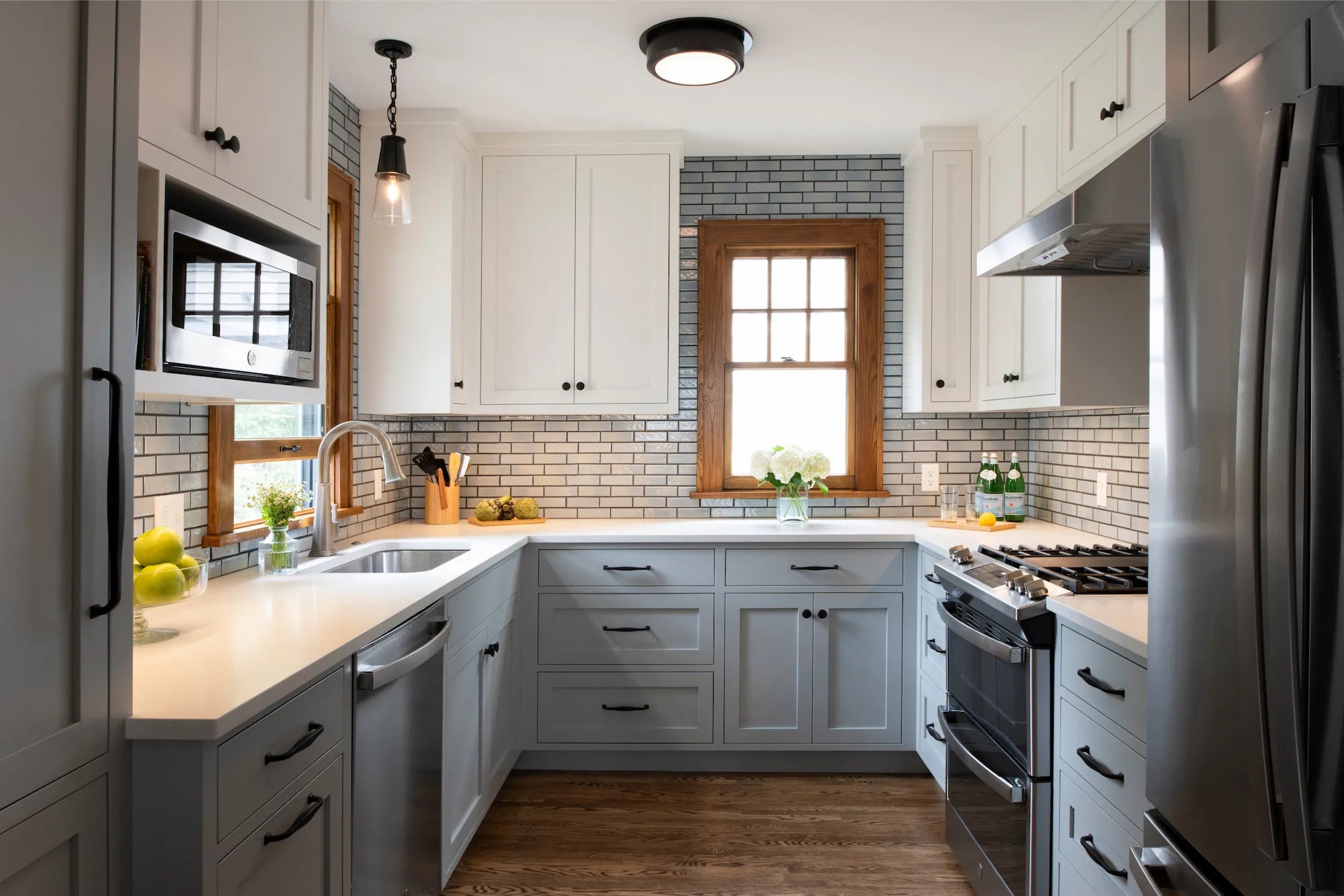 Modern kitchen cabinet pulls and knobs in matte black for white shaker drawers and doors in kitchen