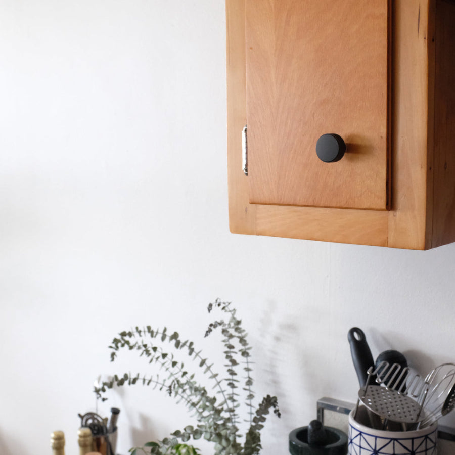Ribbed knob in matte black with minimal design and lines for contemporary projects