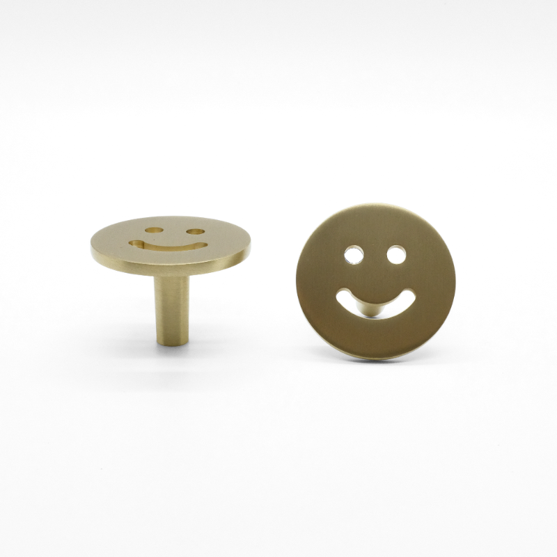 Smiley knob in satin brass - modern knob with eccletic design