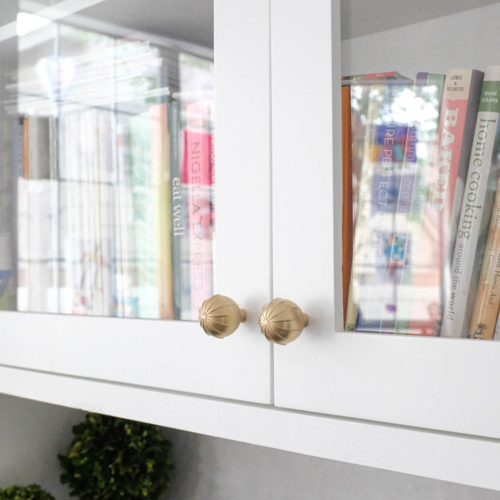 Sunburst cabinet knobs in satin brass - for modern doors and drawers