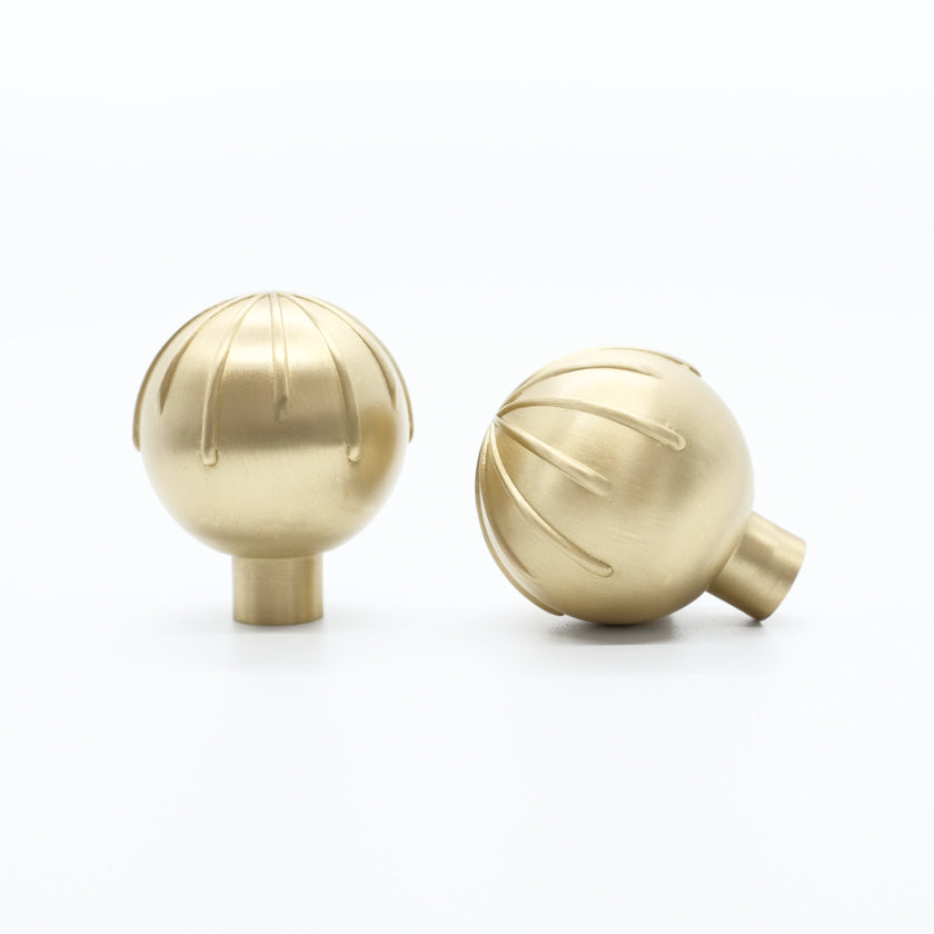 Sunburst knobs in satin brass - mdoern knobs for playful eclectic design