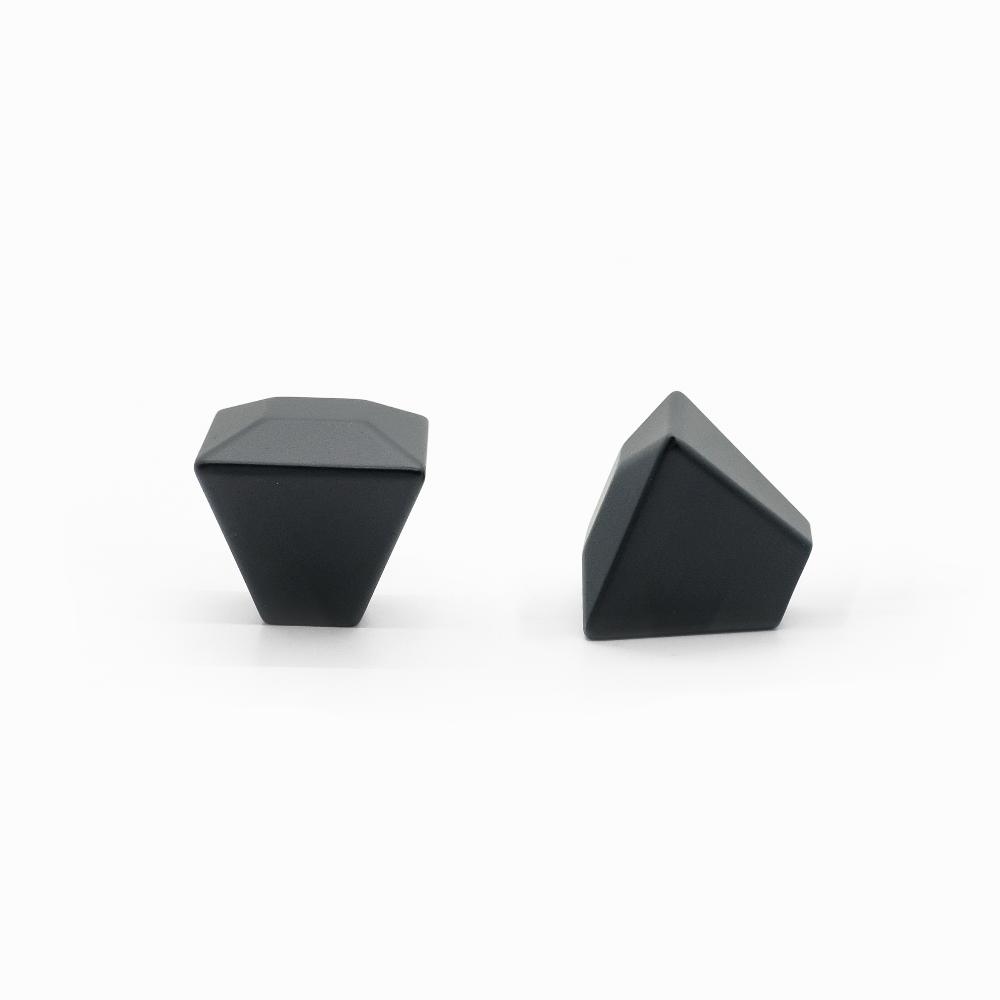 Modern geometric cabinet hardware collection featuring angular, linear, and faceted designs in matte black, satin brass, and polished nickel finishes.