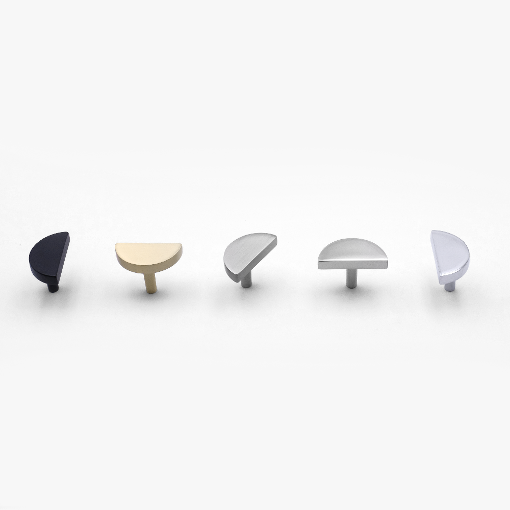 Curved half moon knobs available in modern finishes for cabinets