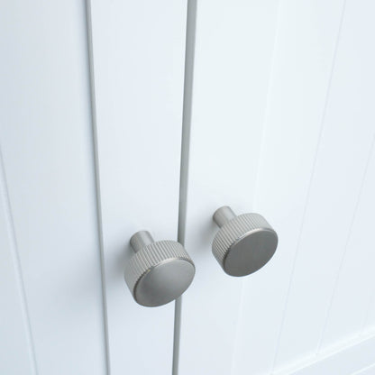 Ribbed knobs in satin nickel with industrial grooves and etched design