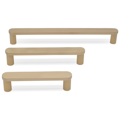 Rounded ribbed modern cabinet pull in satin brass for contemporary and transitional spaces
