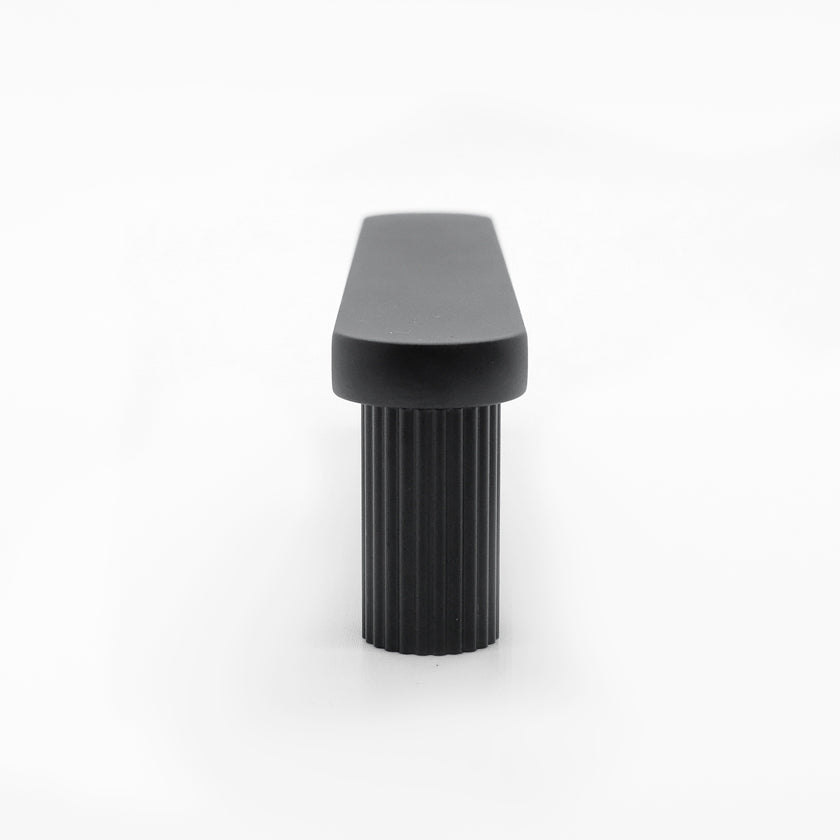 Industrial designed ribbed pull in matte black with texture and smooth feature