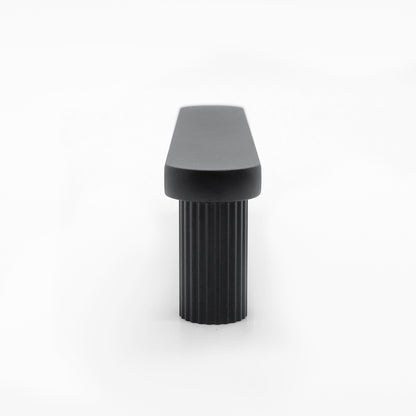 Industrial designed ribbed pull in matte black with texture and smooth feature