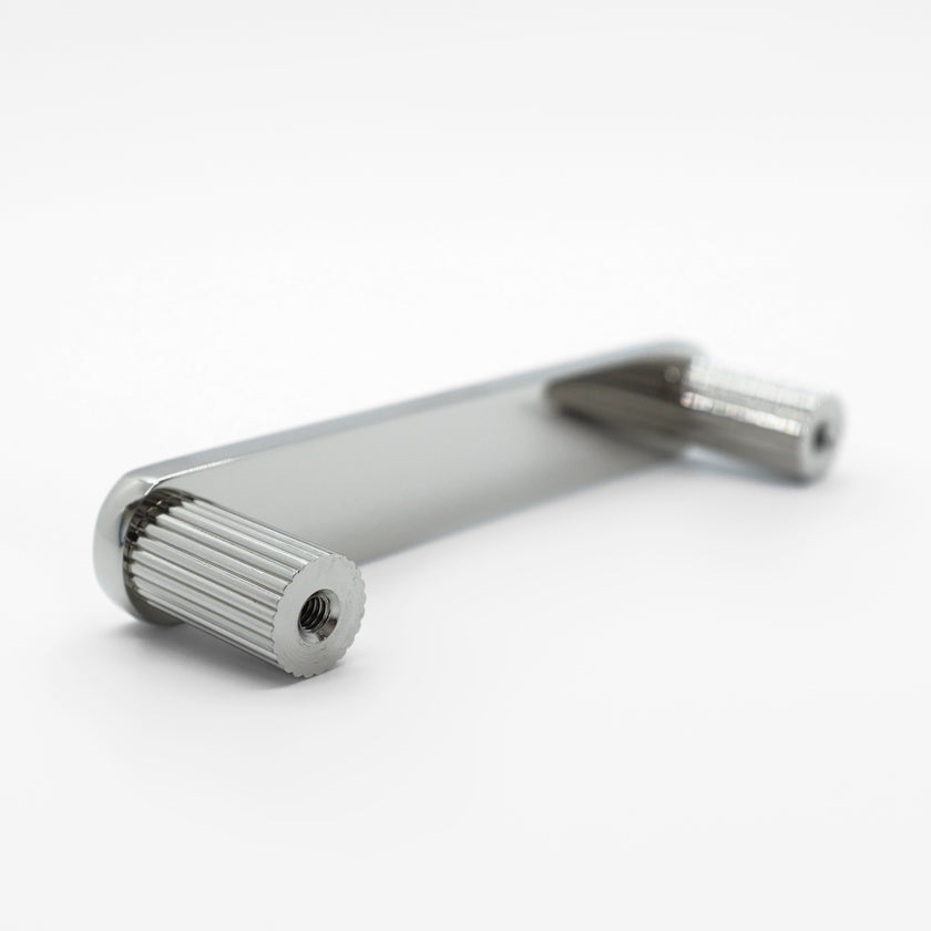 Minimalist ribbed pull in polished nickel for modern bathrooms and drawers