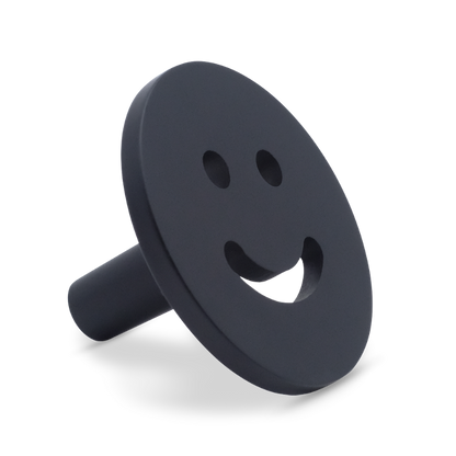 Smiley knob in matte black for modern spaces with playful style