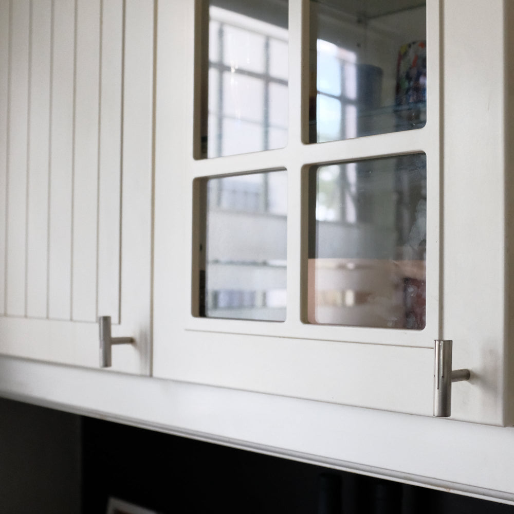 Sunburst T-Knobs in satin nickel for modern kitchen cabinet doors