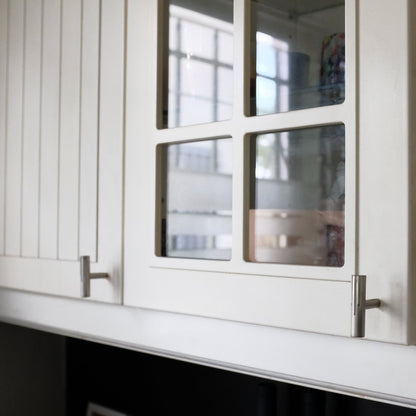 Sunburst T-Knobs in satin nickel for modern kitchen cabinet doors